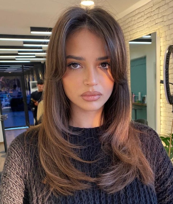 U-Shaped Layering and Curtain Bangs Ladder Layers and Blowout Soft Curtain Bangs