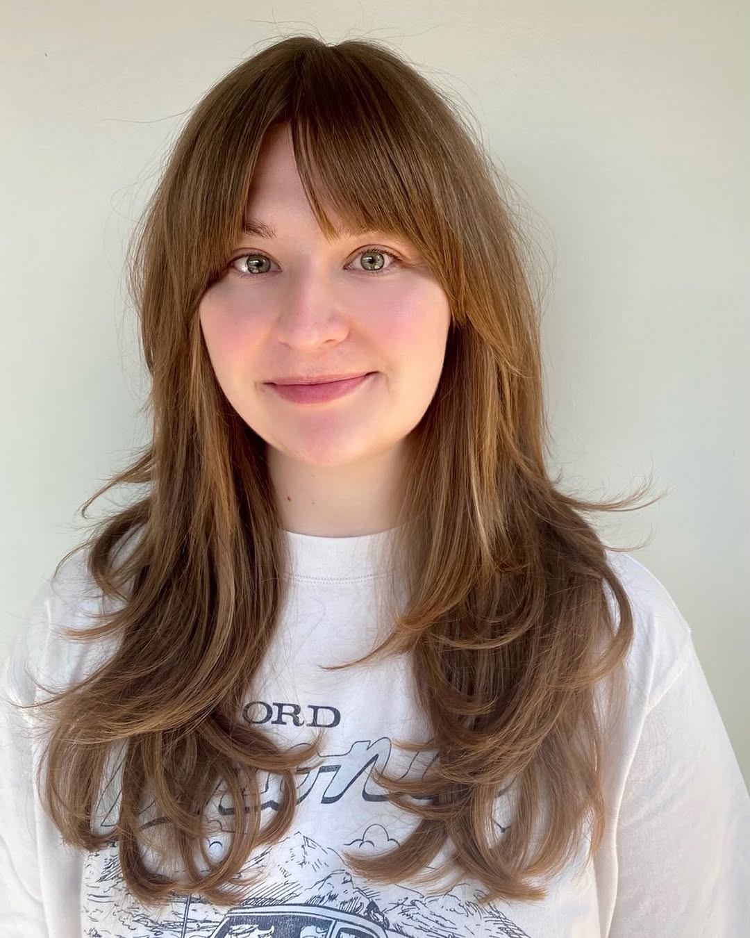 Haircut with Birkin Bangs Long Layered cut with Birkin Bangs