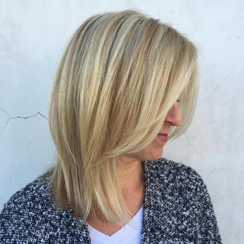 Blonde Layers on Sweeping Locks Blonde Lob And Face Framing Bangs