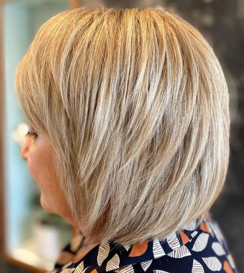 Voluminous Feathered Bob Heavily Layered Thick Blonde Bob with Bangs
