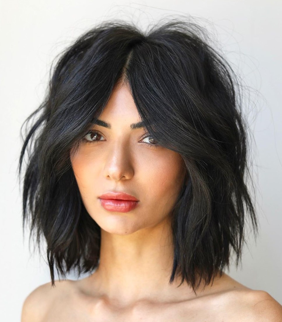 Short Choppy Layers and Curtain Bangs Short Choppy Layers and Middle Part Bangs