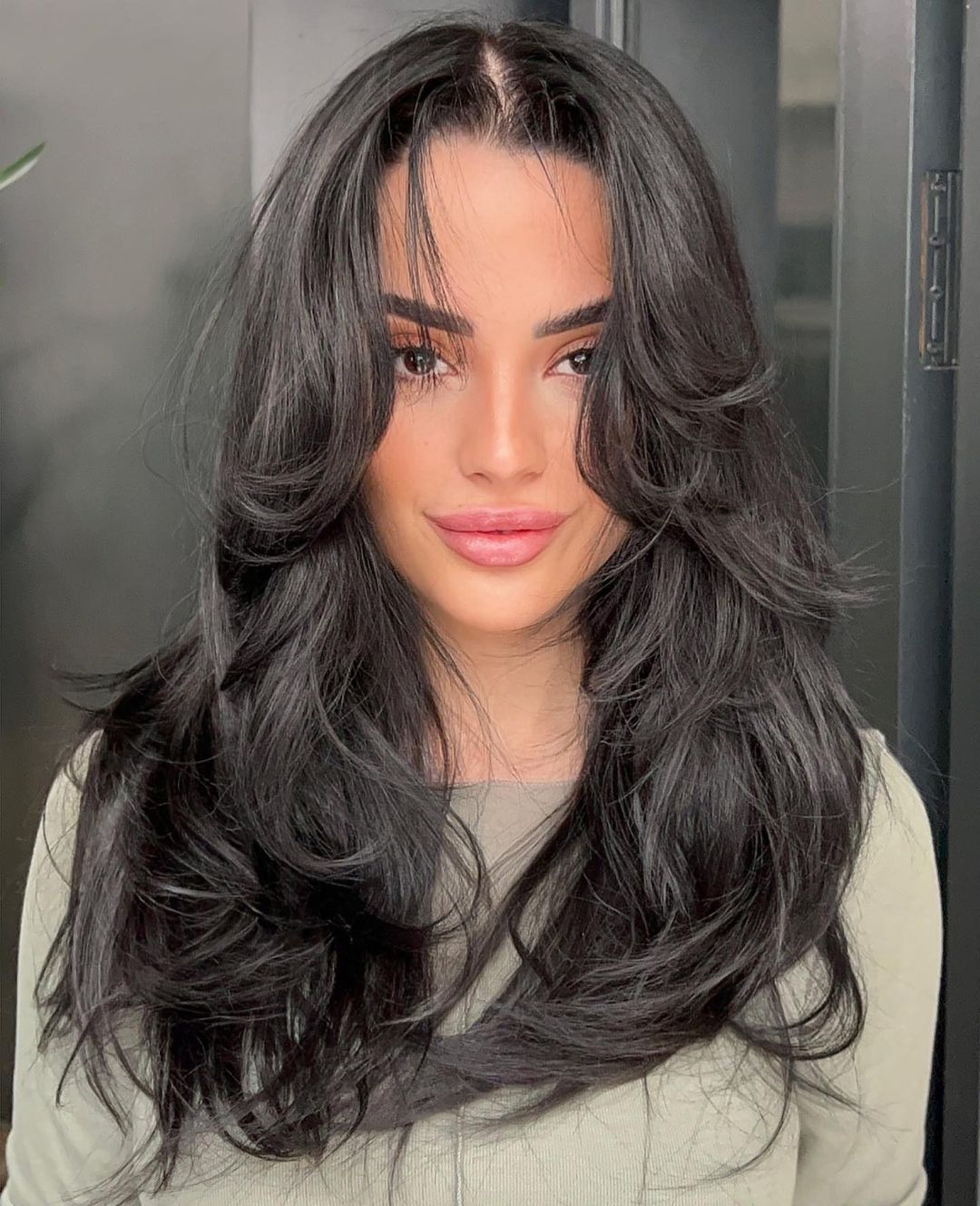 Feathered Layers and Curtain Bangs Blowout Layered Hairstyle with Thin Curtain Bangs