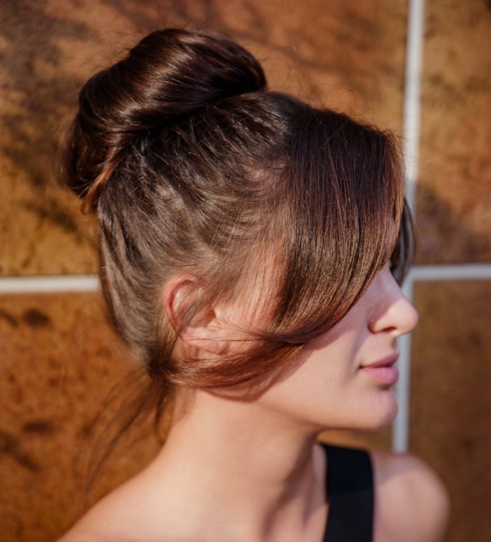 Loose Bun with Curtain Bangs