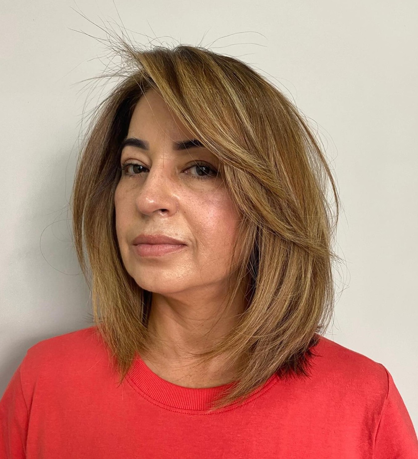 Medium Length Hairstyle with Side Bangs for Women over 50