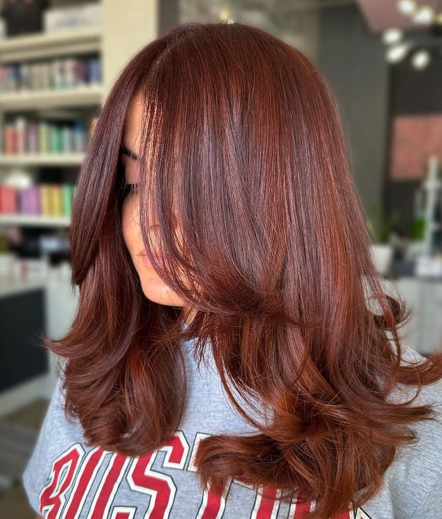 Red Hair with Layers and Curtain Bangs Chin Length Curtain Bangs Blending into Medium Layers